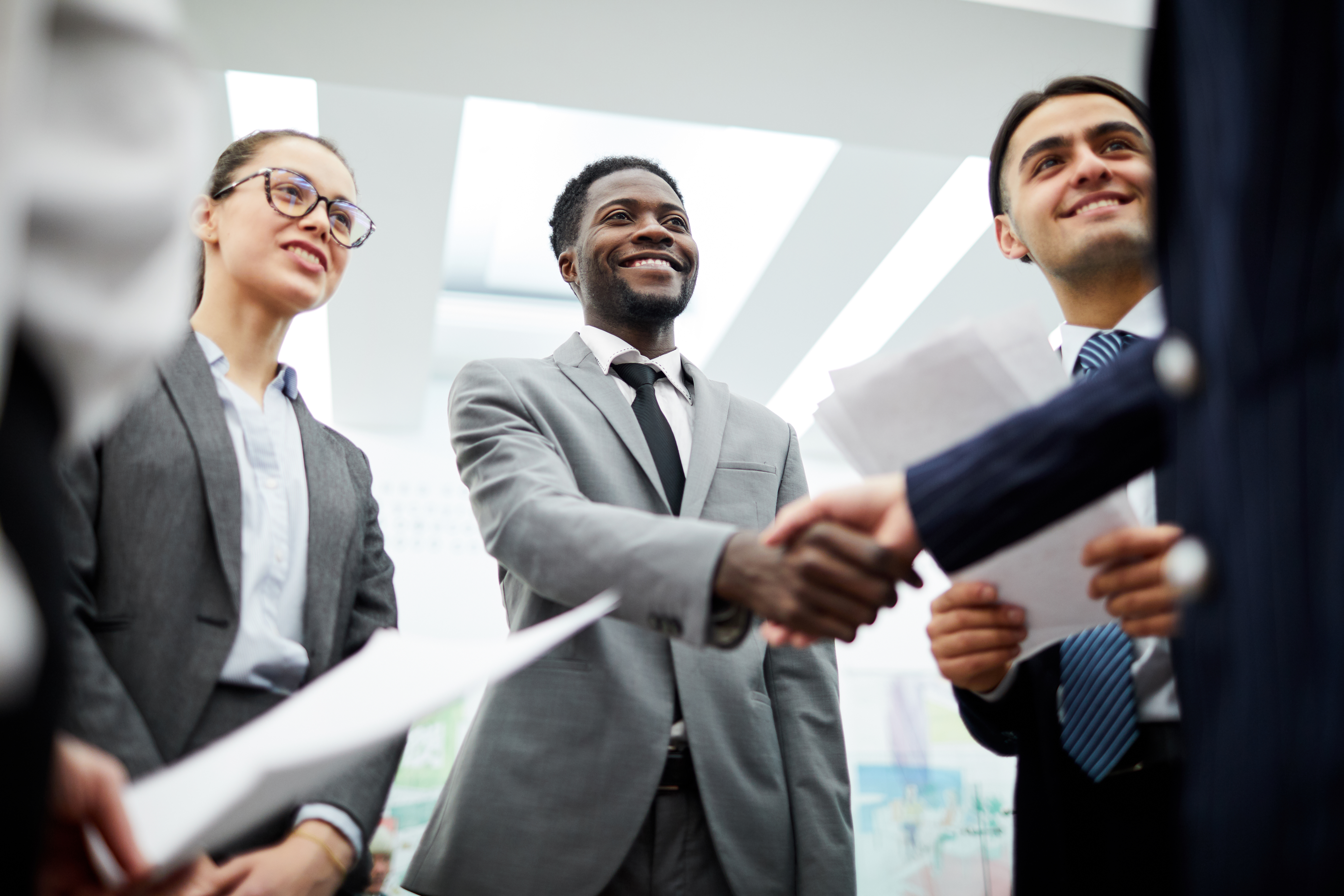 Business agreement professionals shaking hands